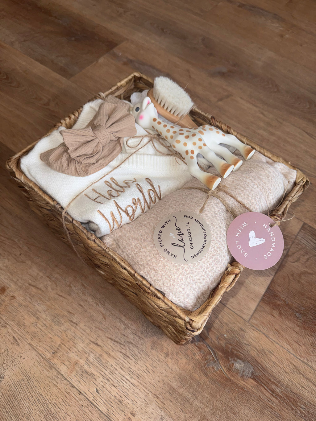 Baby girl, tan and white gift basket featuring Sophie the giraffe (6 pieces)