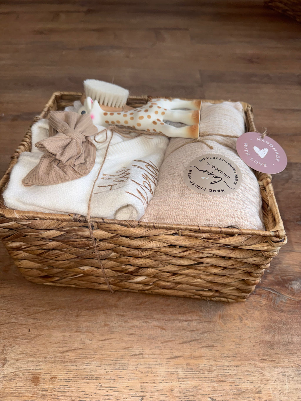 Baby girl, tan and white gift basket featuring Sophie the giraffe (6 pieces)