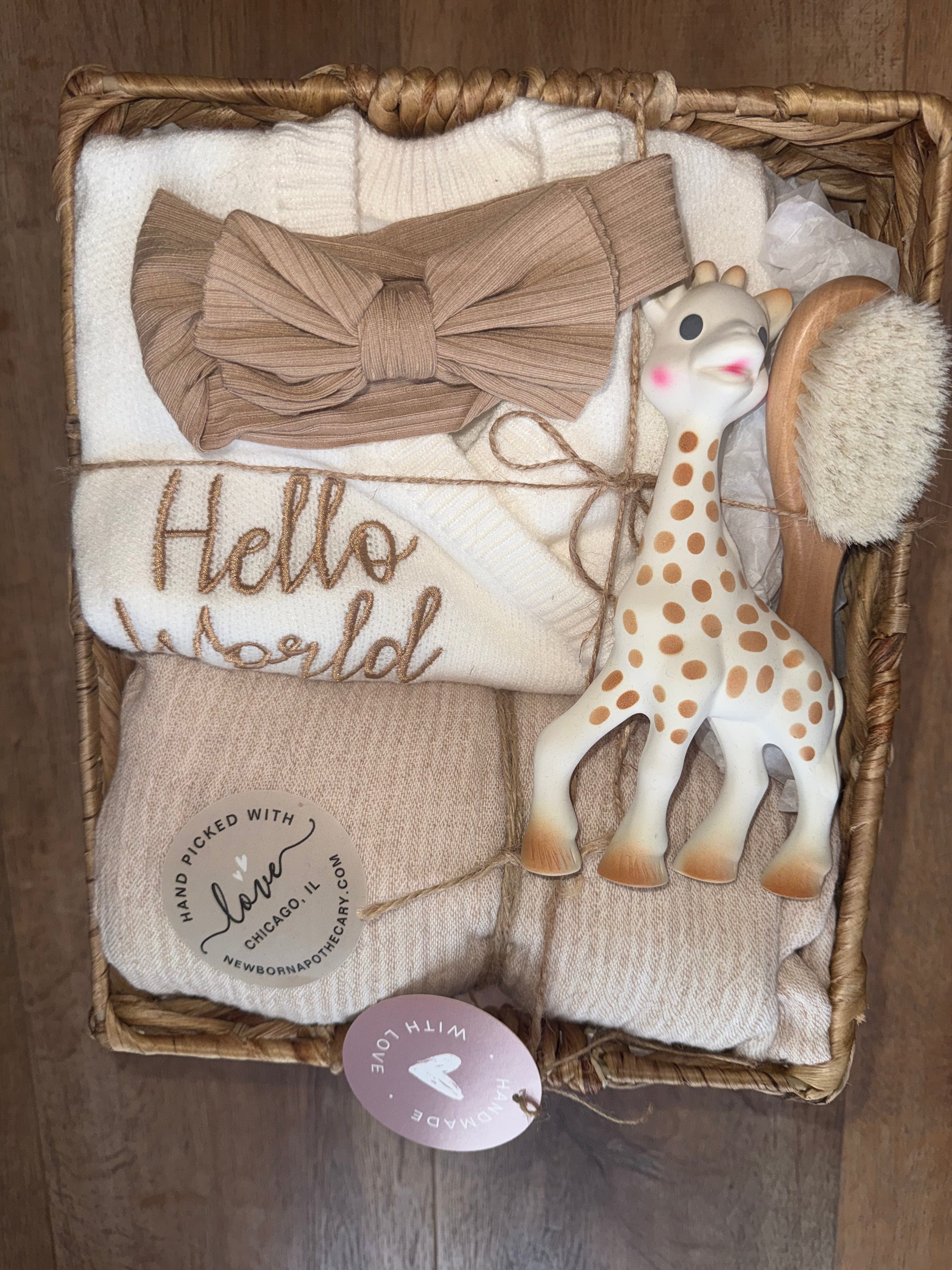 Baby girl, tan and white gift basket featuring Sophie the giraffe (6 pieces)